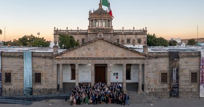 Canadian delegates standing in front of government building in Mexico.